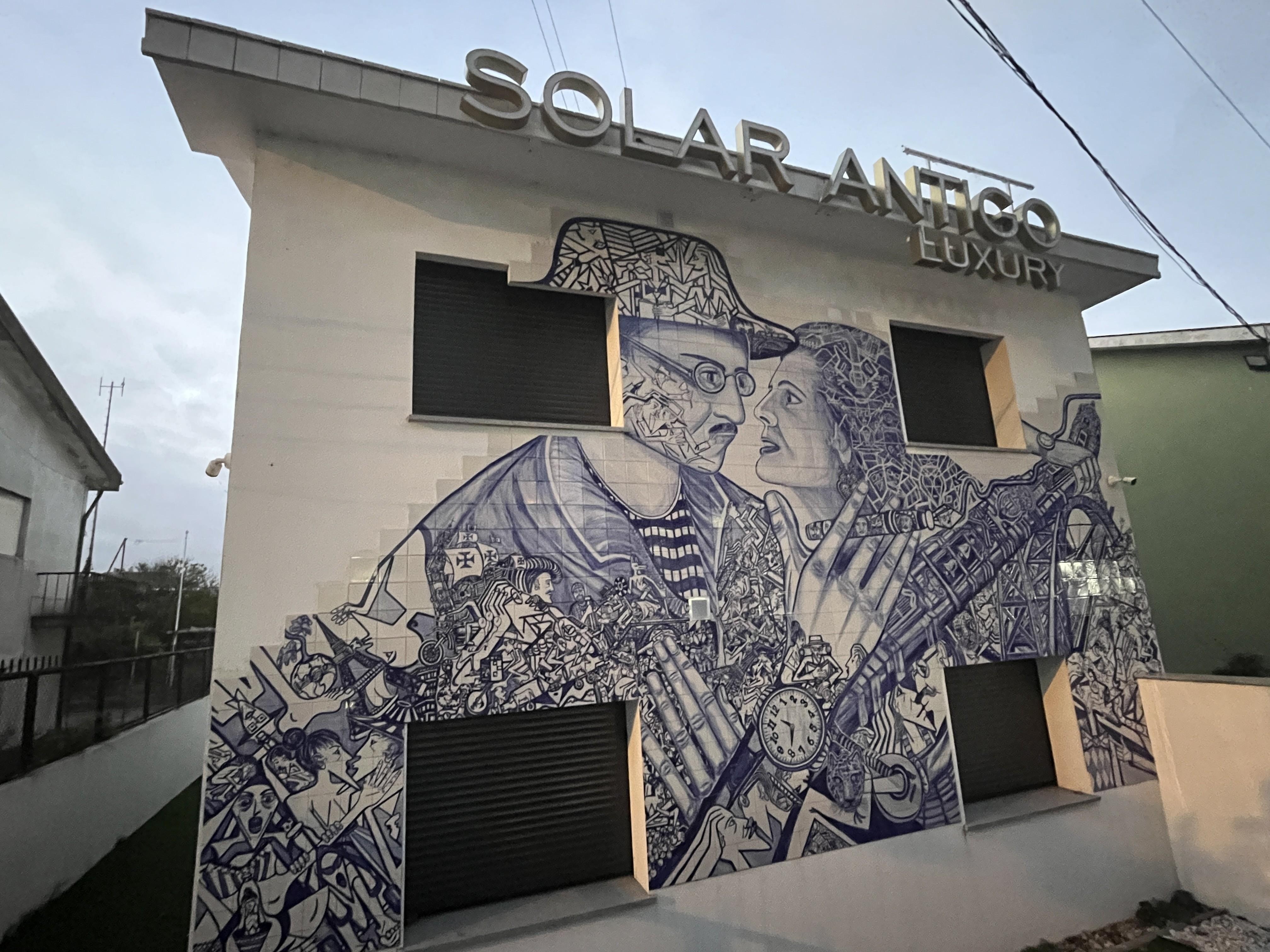 Beautiful hand made tiles on front of building.