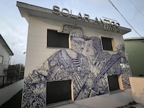 Beautiful hand made tiles on front of building.
