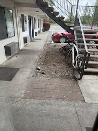 Part of the back parking lot and staircase