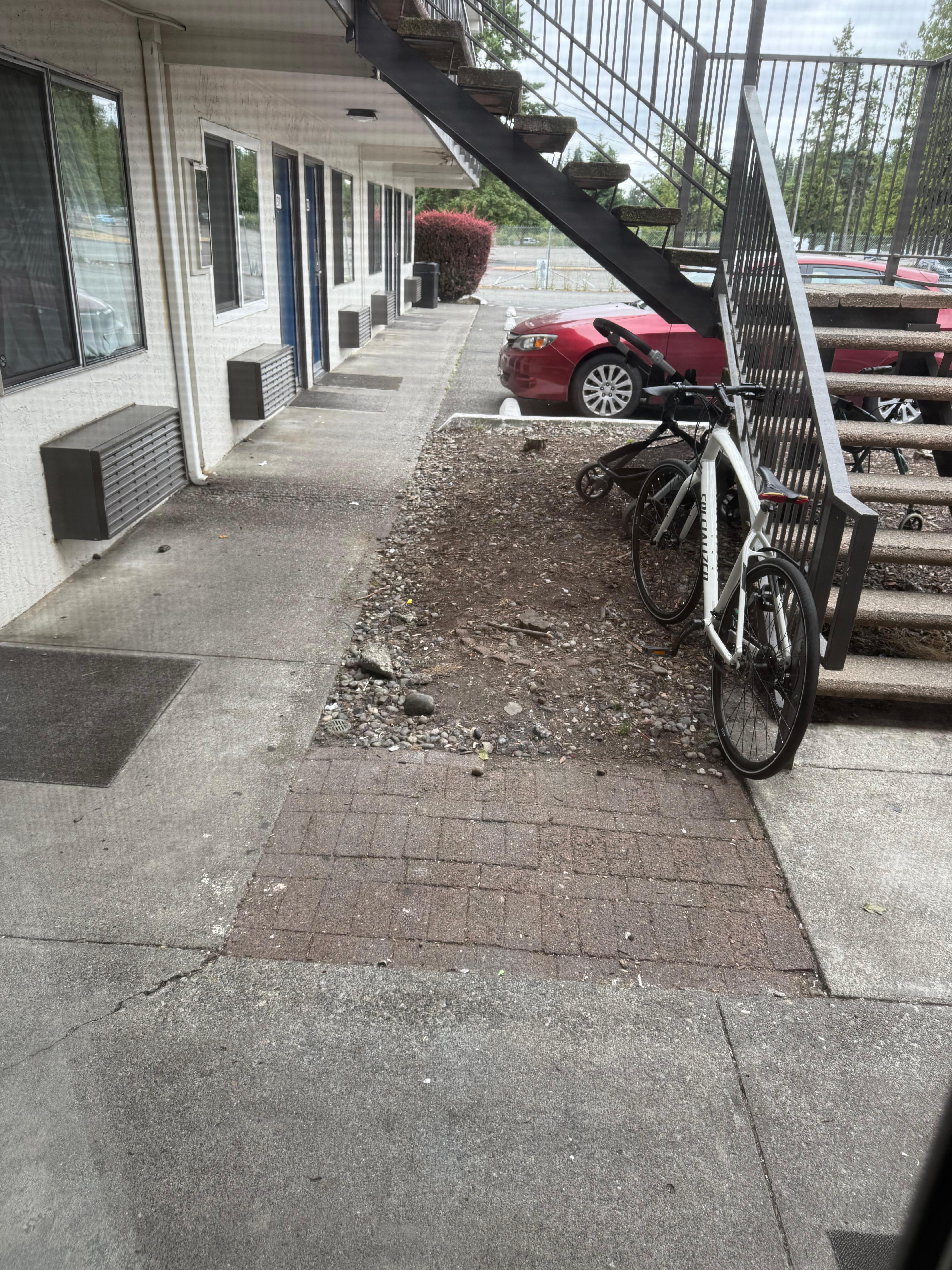 Part of the back parking lot and staircase