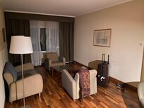 Large sitting room but with dated decor and only one useable power socket
