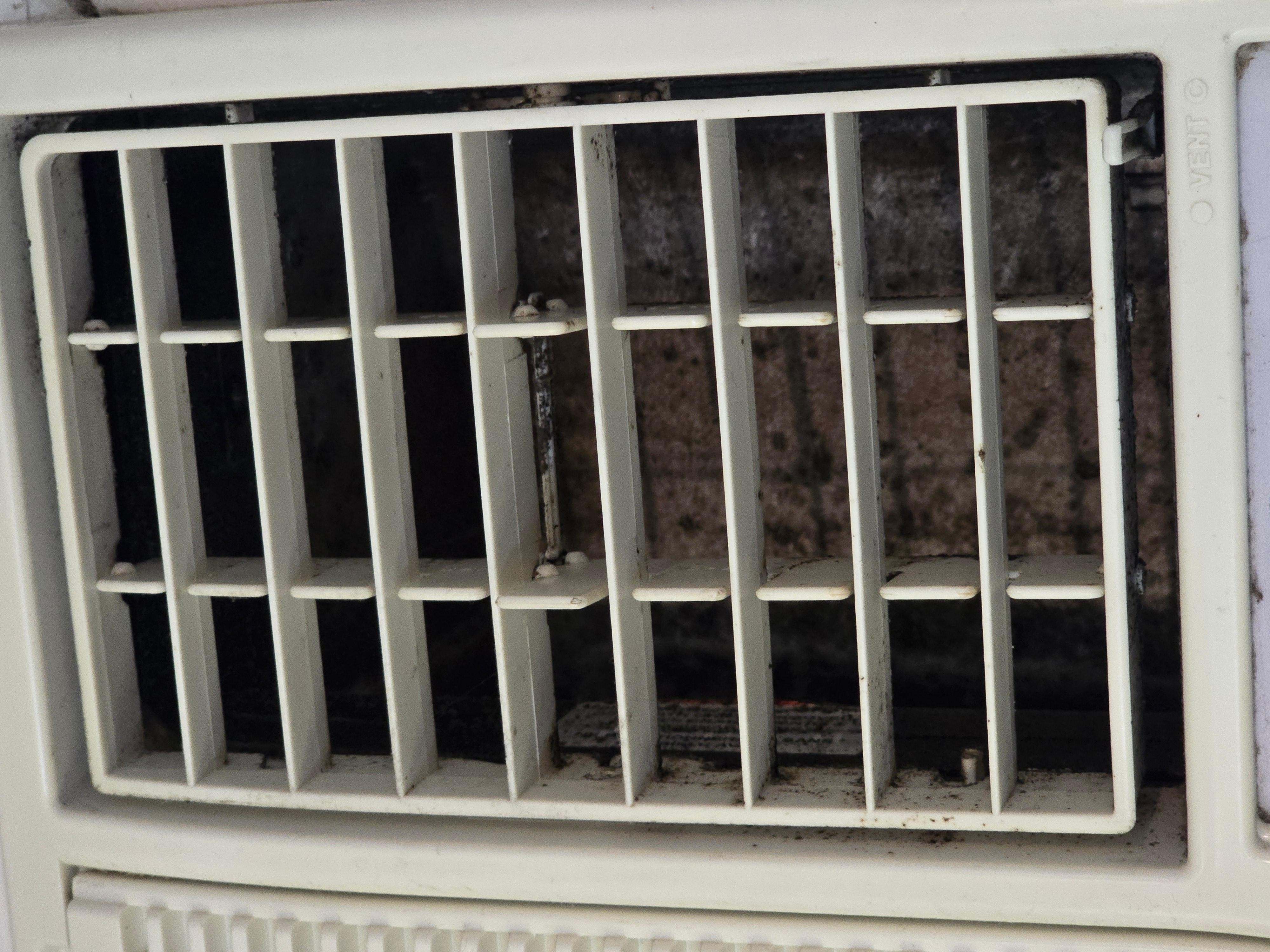 Disgusting window AC unit downstairs