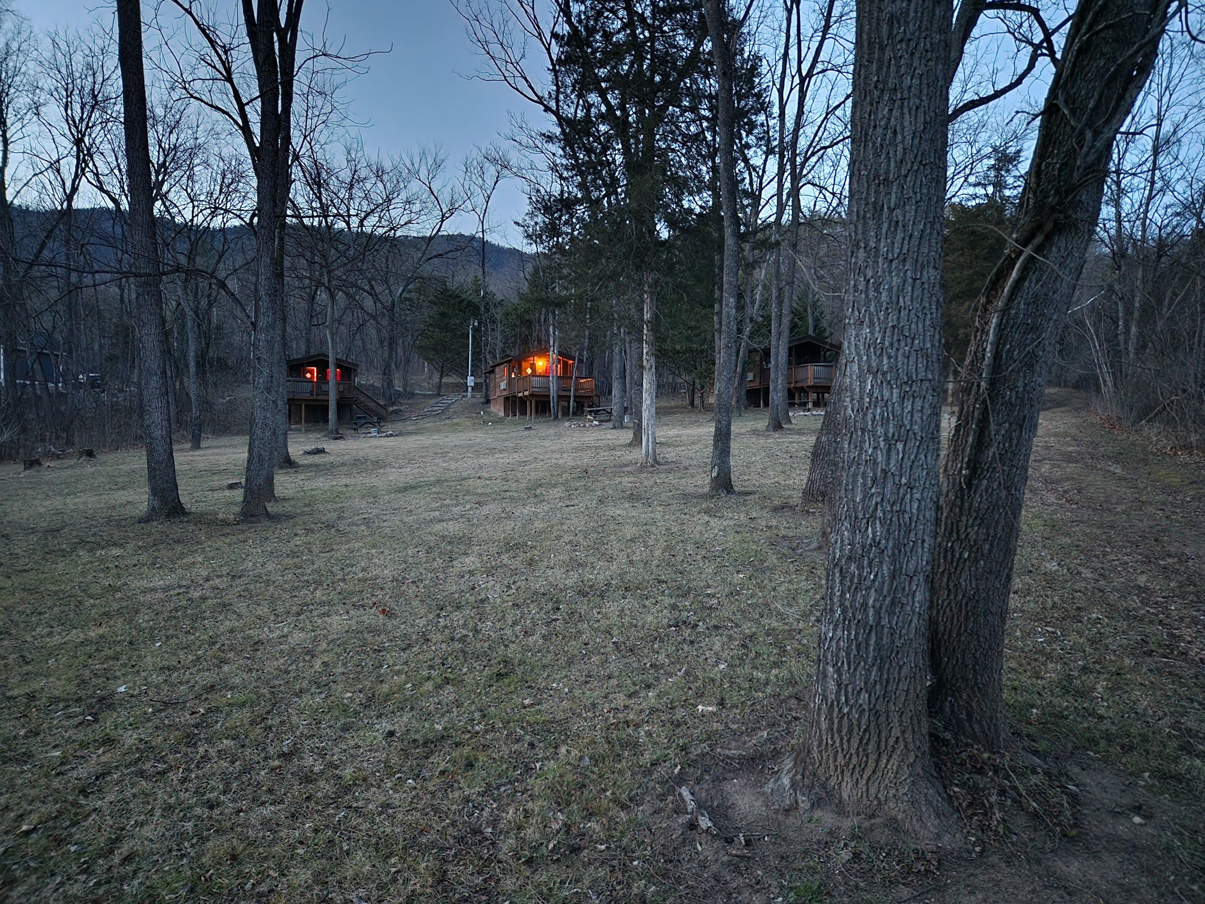 Looking up at the cozy cabins from the river
