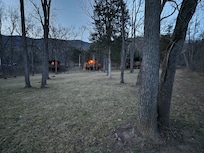 Looking up at the cozy cabins from the river