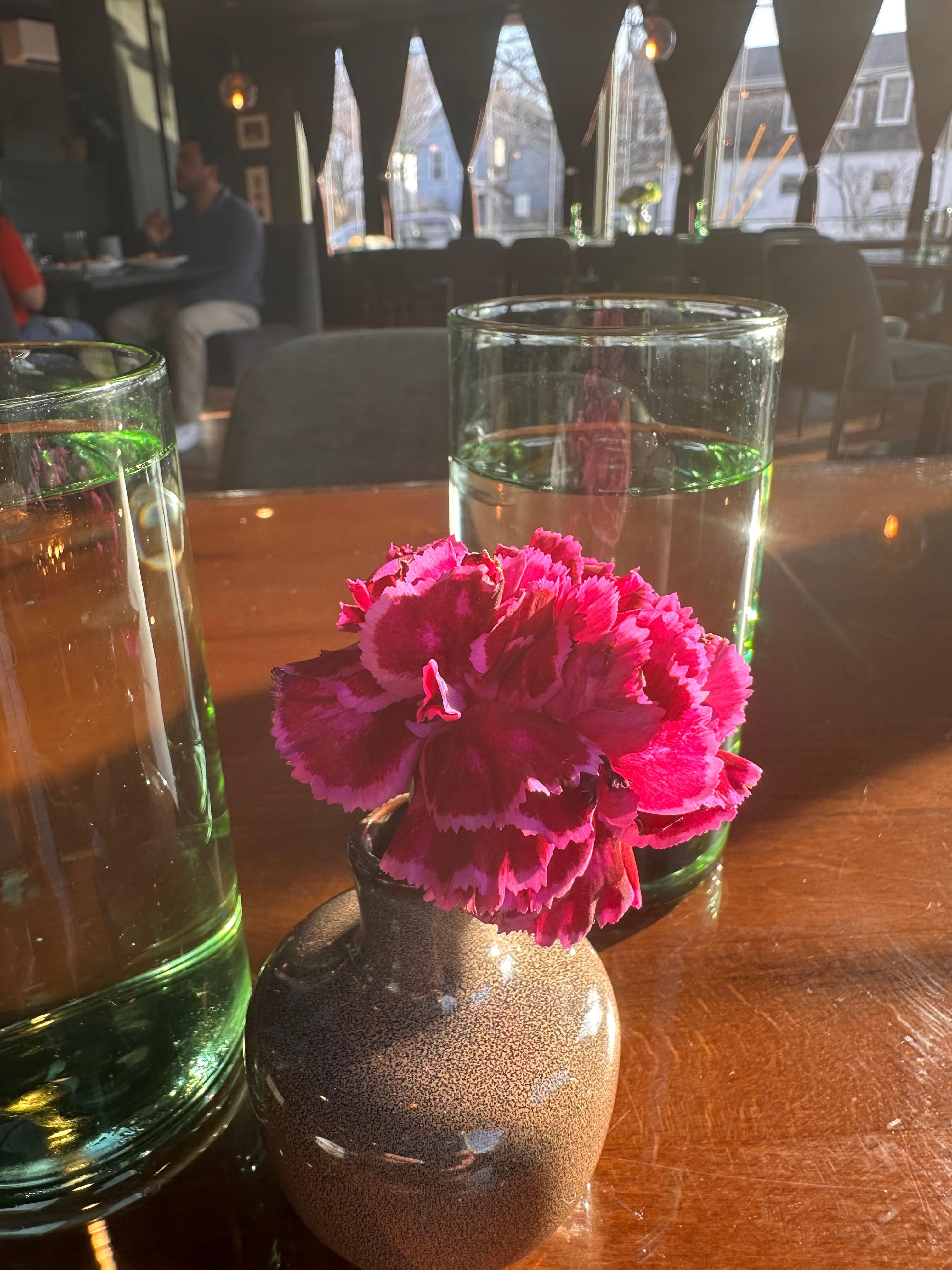 Fresh bud waiting for us at breakfast with a beautifully set table. Pretty and windows to the street. 