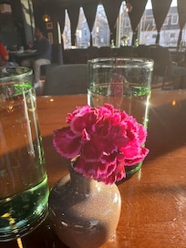 Fresh bud waiting for us at breakfast with a beautifully set table. Pretty and windows to the street.