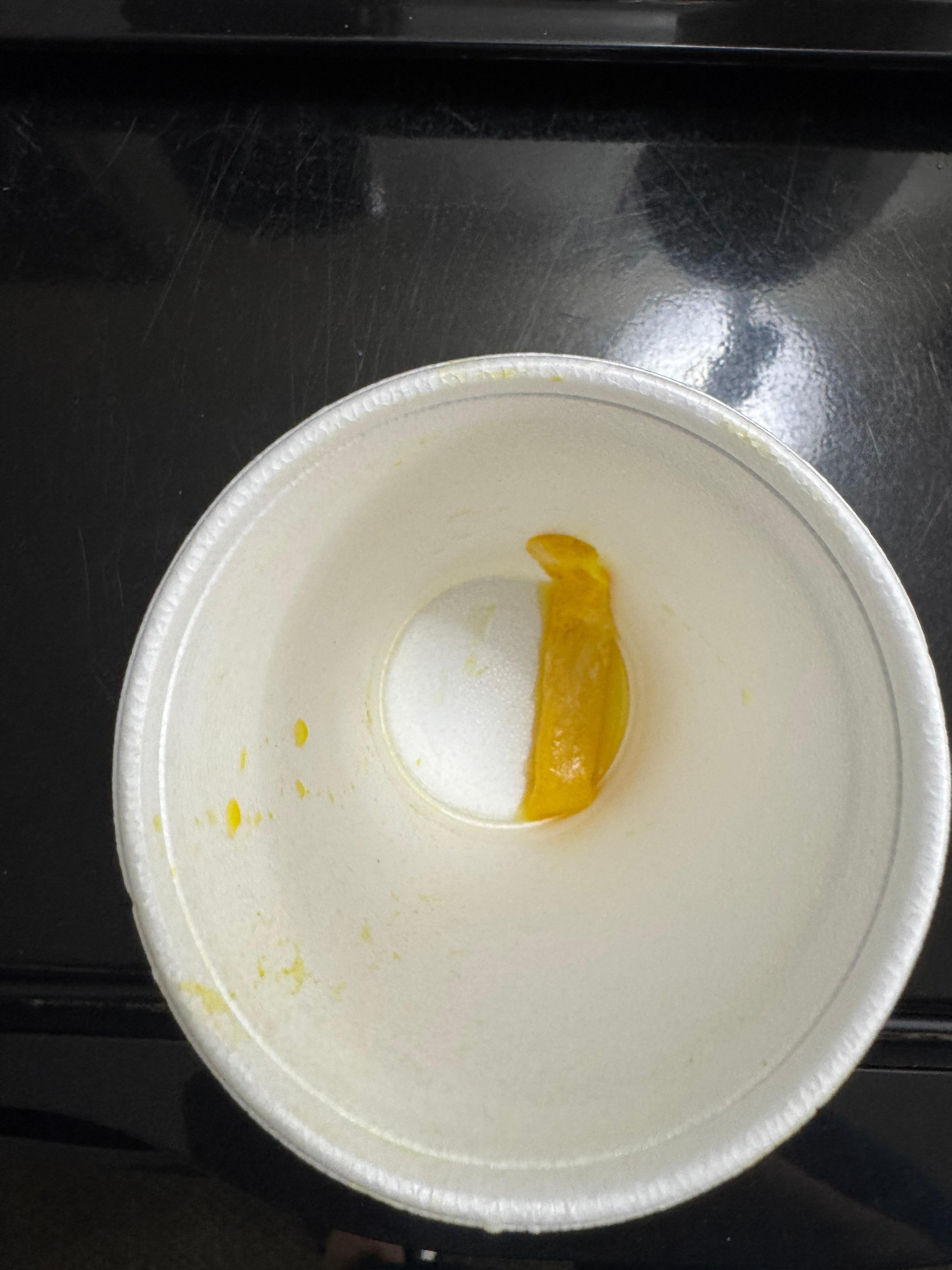 Found at bottom of orange juice cup after I drank most of it. 