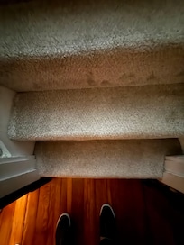 Tread of stairs narrower than ADA requirement.