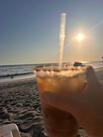 Enjoying a michelada watching the sunset and the ocean
