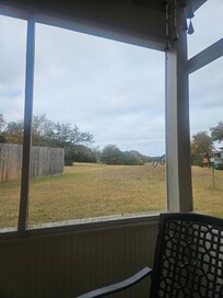 Screened-in back porch view