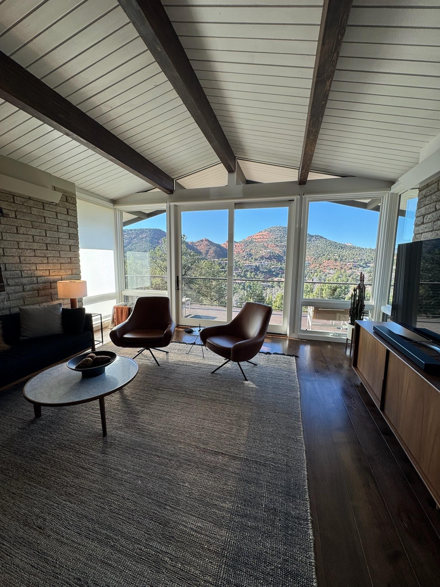 A beautifully furnished mid-century home with great views from the main living and dining areas. 