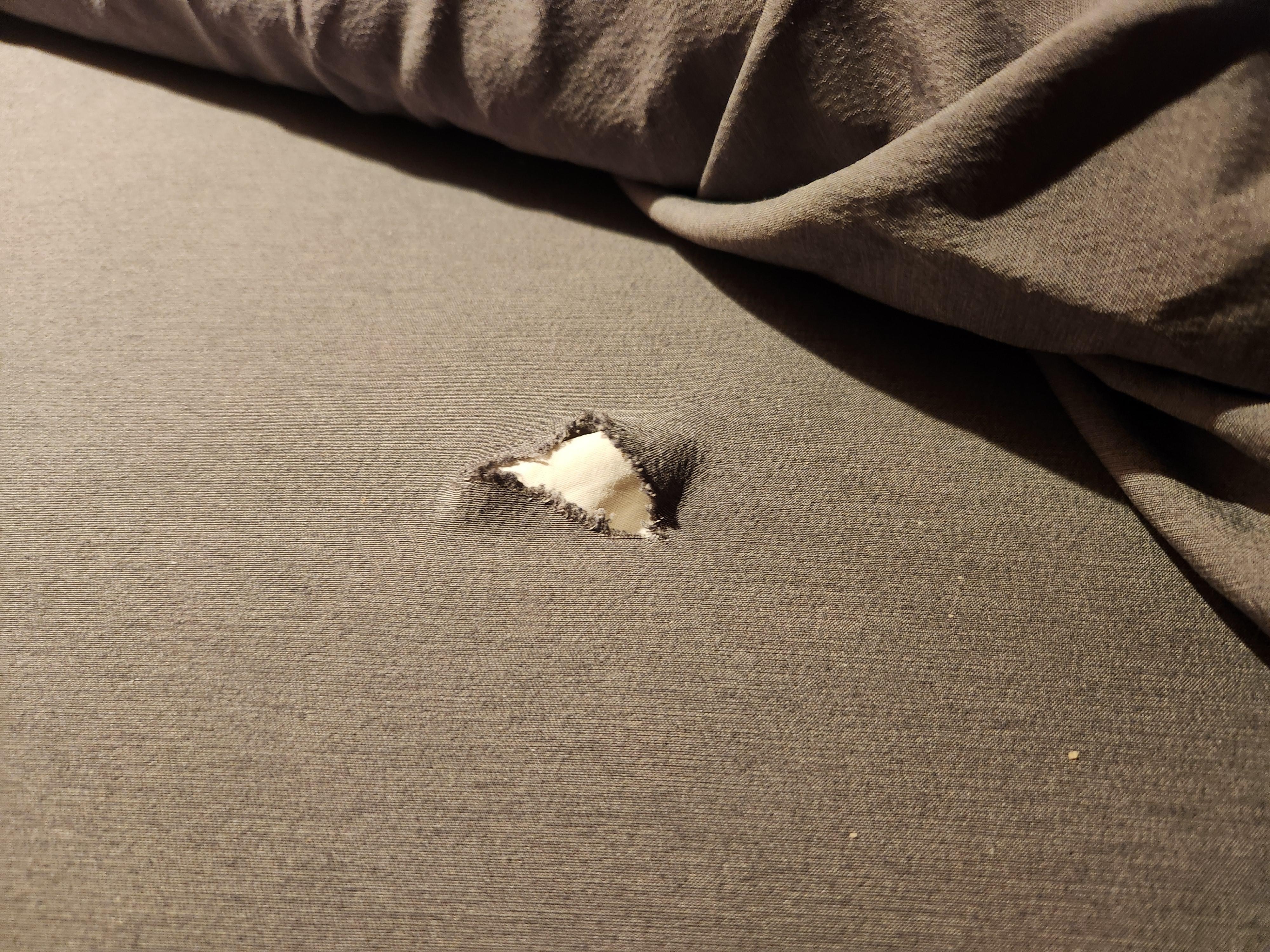 a tear the sheet on the bed