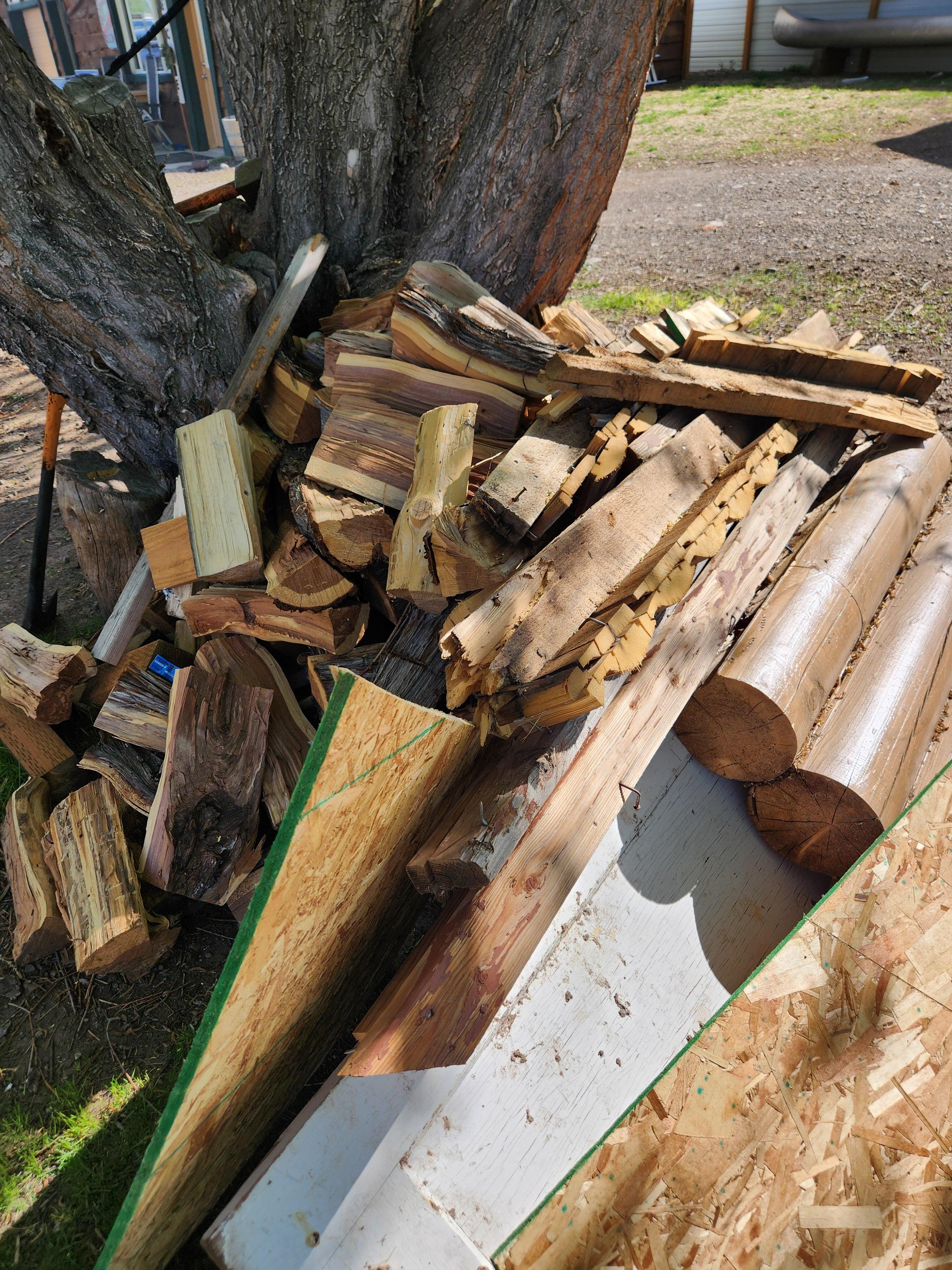 Pile of wood- lots with nails in it. Some wood also was treated or painted and shouldn't be used for cooking over.