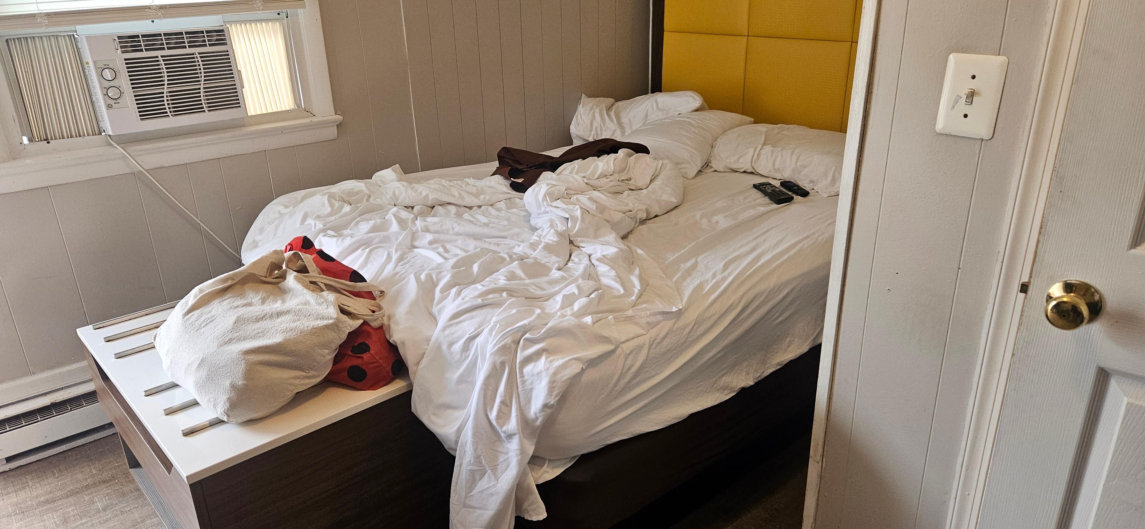 Small bed area without any kind of nightstand