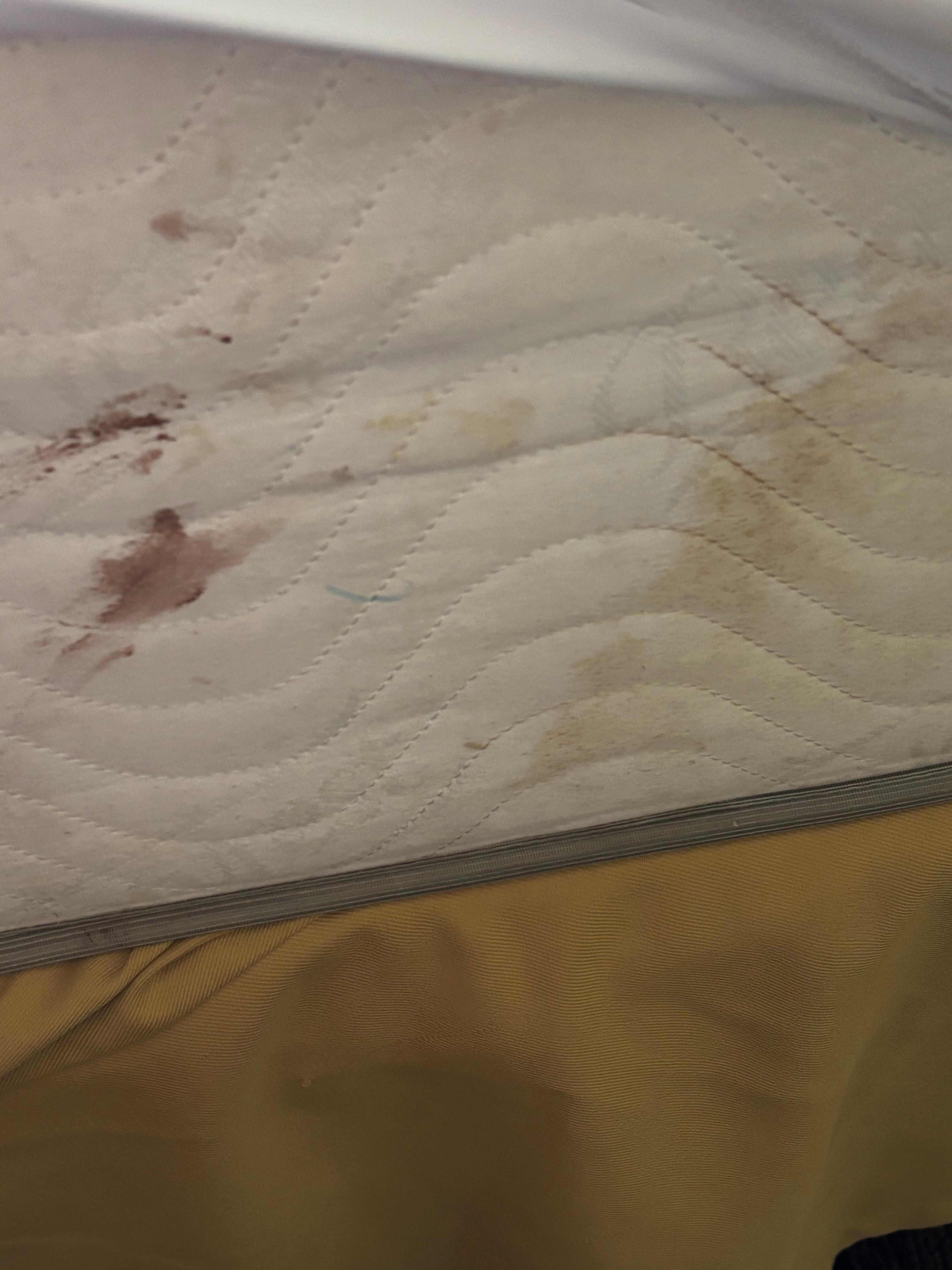 Zoom in, blood and dirt on mattress. 