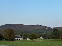 Green mountains starting to get a blush of fall colors
