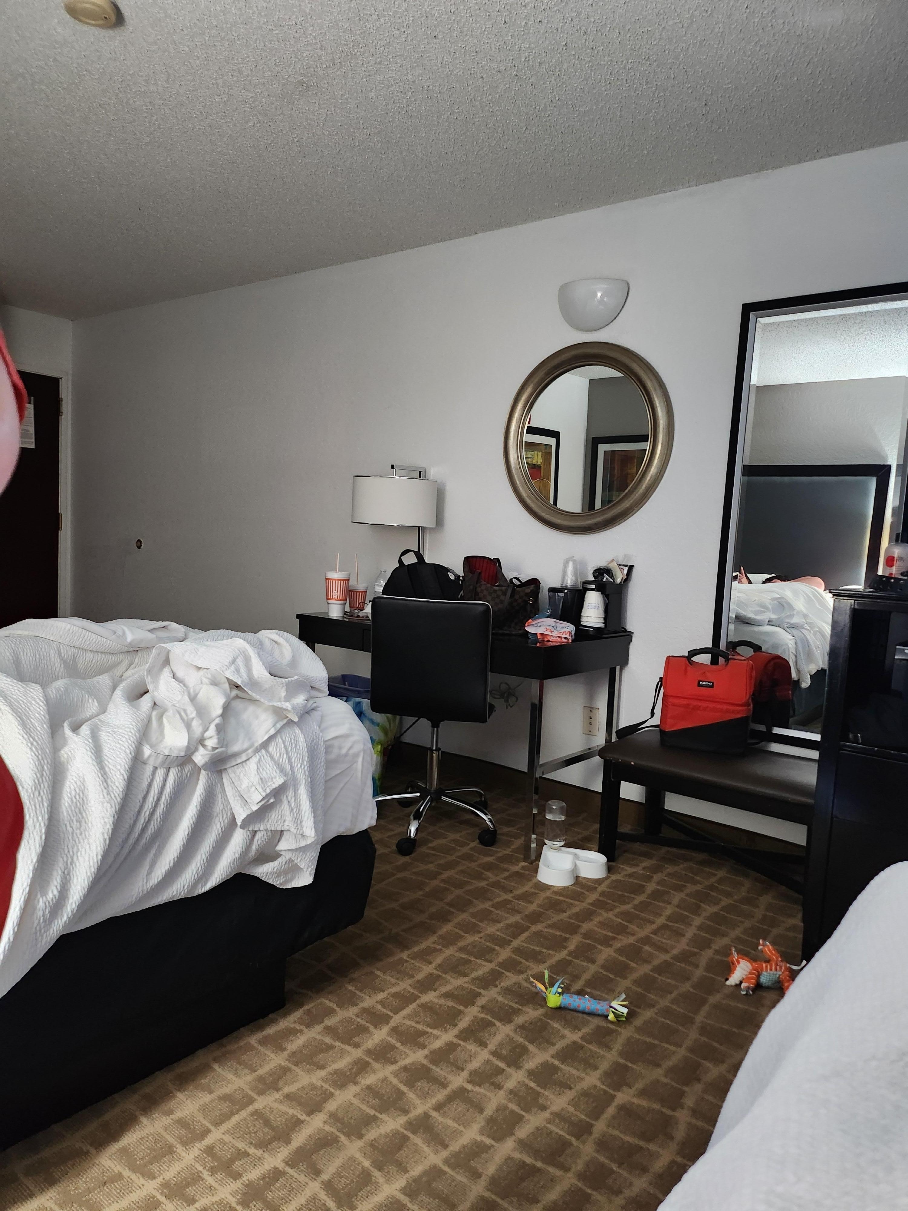 Standing by the second bed showing the other side of the room because you could not get by the window to take a picture