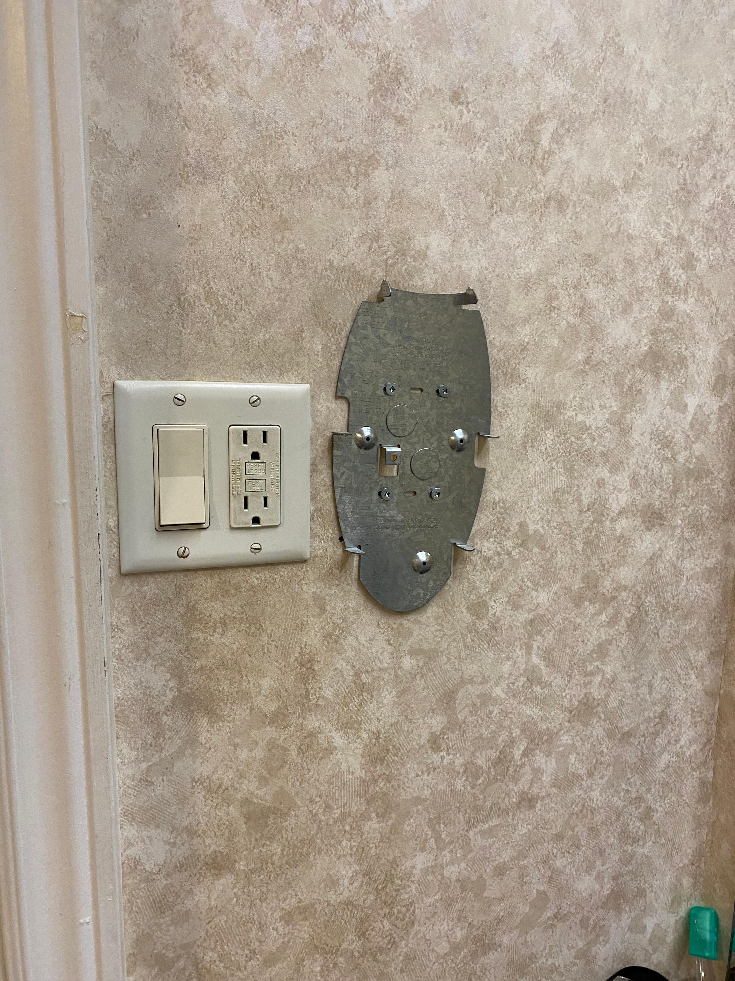 Grubby switches and old equipment parts on wall