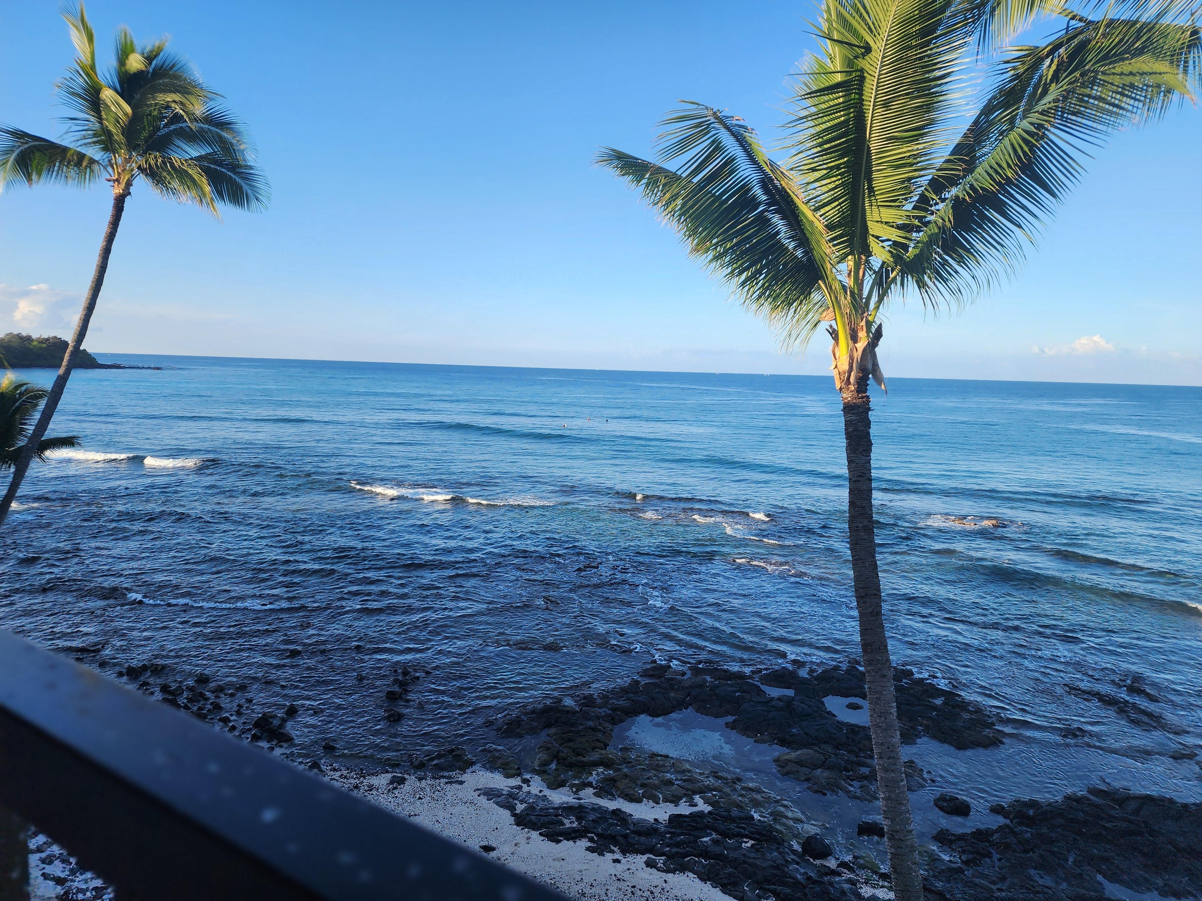 Sunrise off the balcony with surfers in the lineup