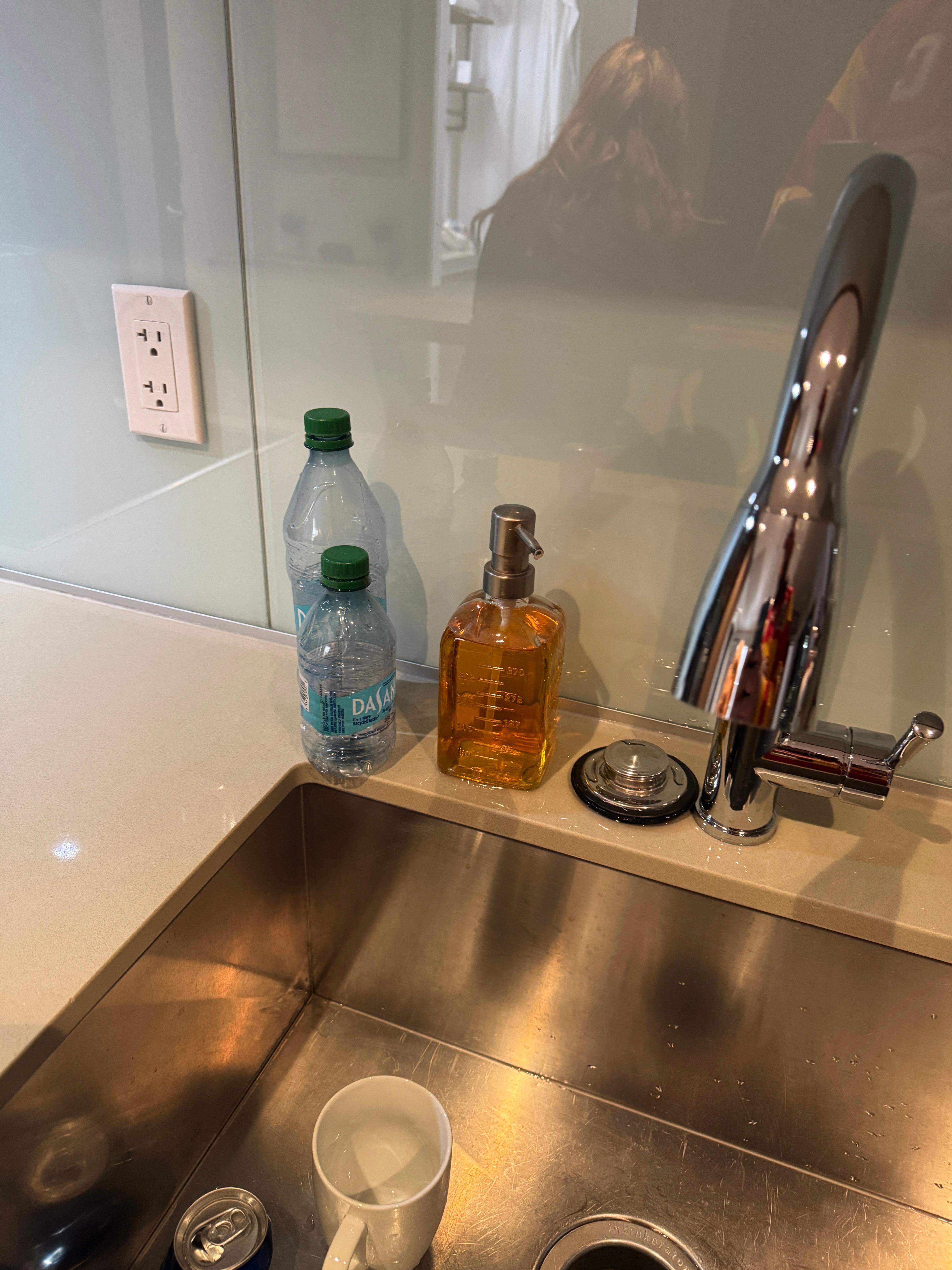 Used water bottles on the counter