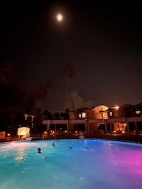 Enjoying the pool at the complex, under moonlight
