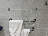 Exposed brackets from missing wall bar