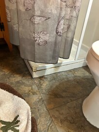 Shortened Shower Curtain which Allows Water to Drip/Drain onto Bathroom Floor
