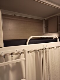 Dorm bedroom . Spacious. Mattress sleep very well. Well lite with storage spaces underneath and top