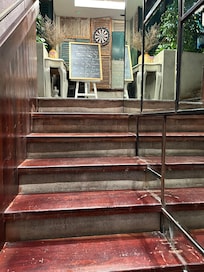 Stairs (dated) to small rooftop bar.