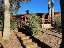 Looking up at the cabin from the tiered deck