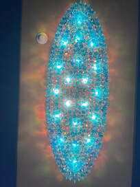 Chandalier in the hallways to the room.