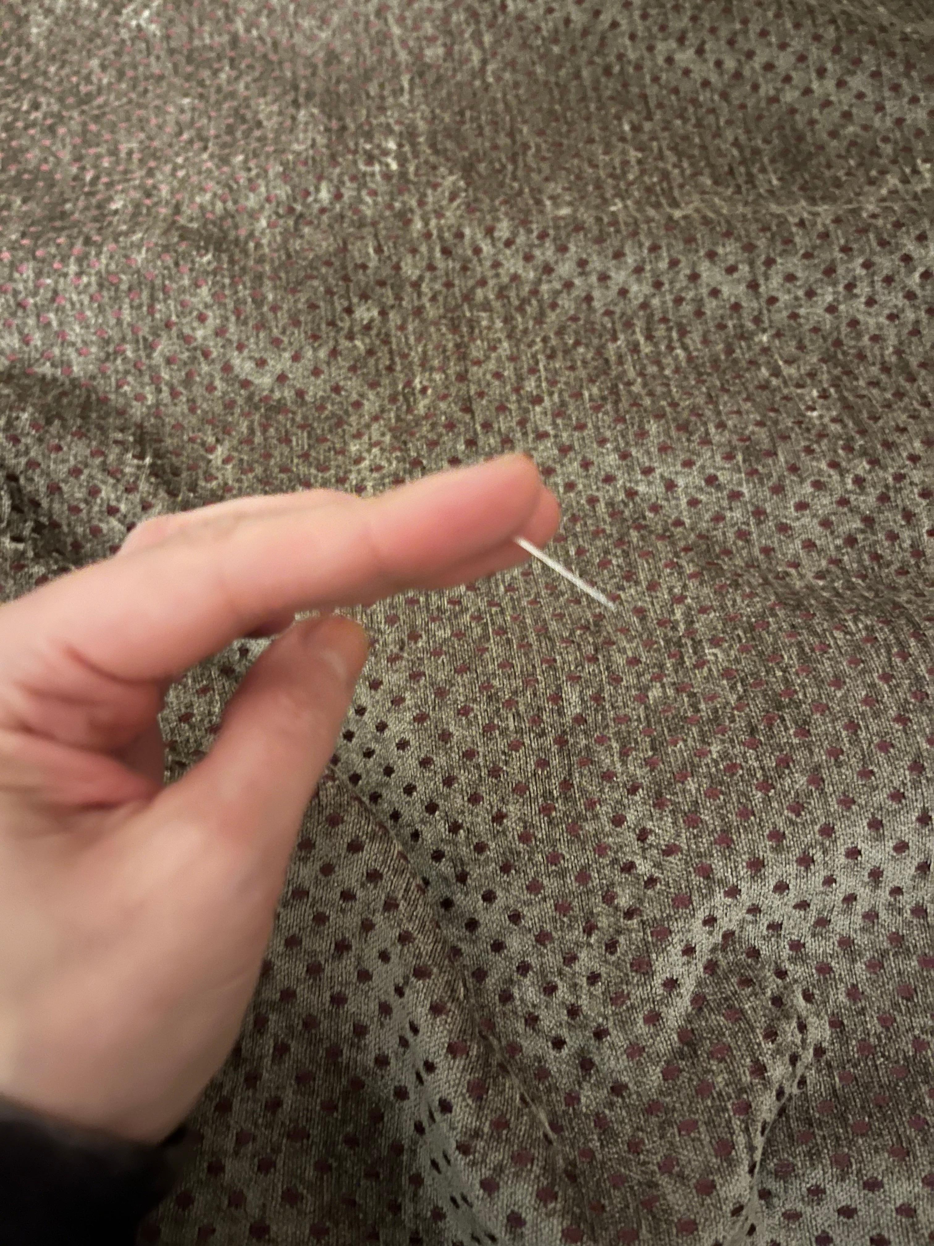 I discovered a sewing needle stuck in my bedding.