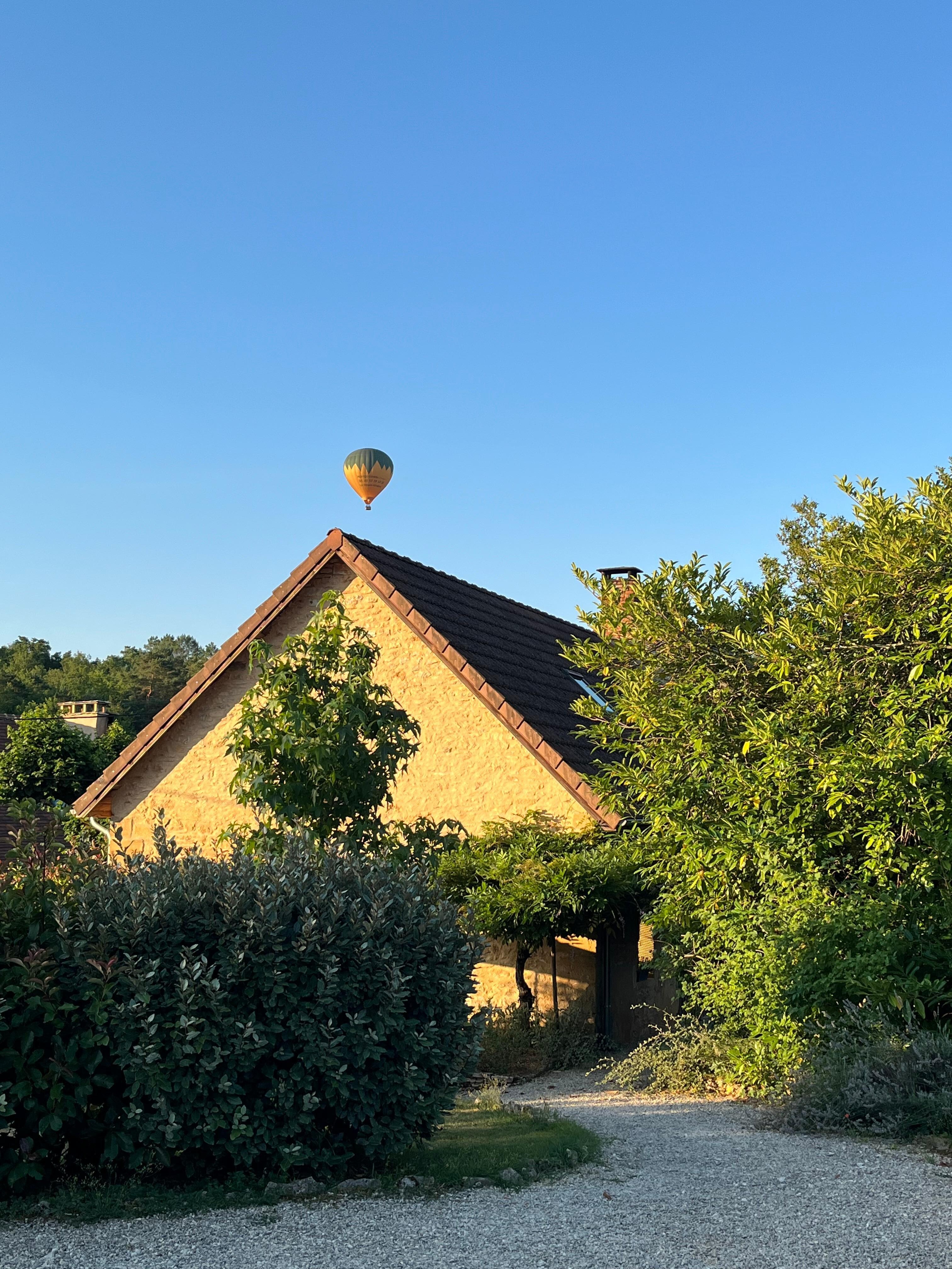 One morning, 5 hot air balloons went over.