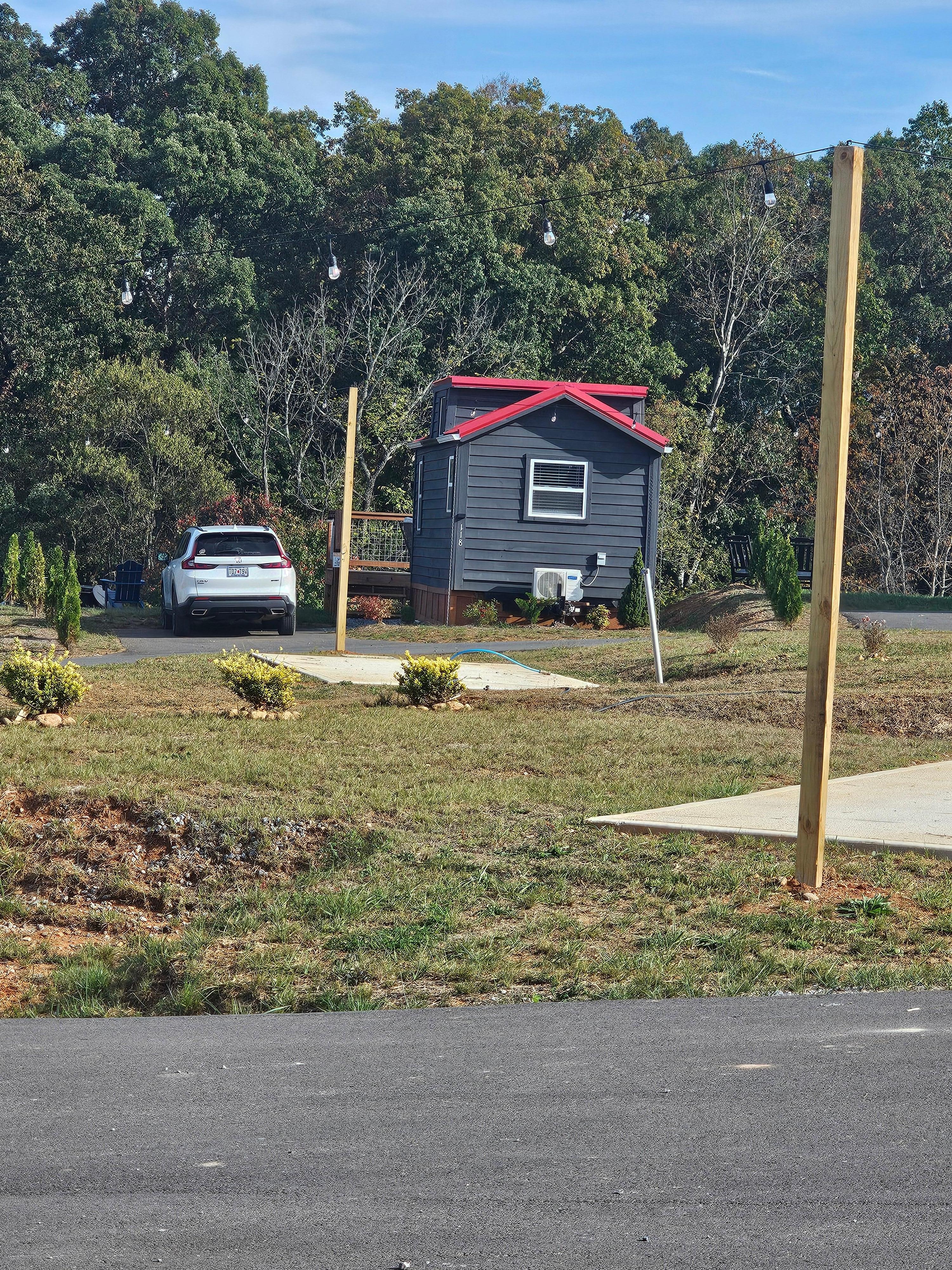 Image of a unit with car next to it for size reference