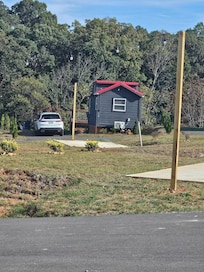 Image of a unit with car next to it for size reference