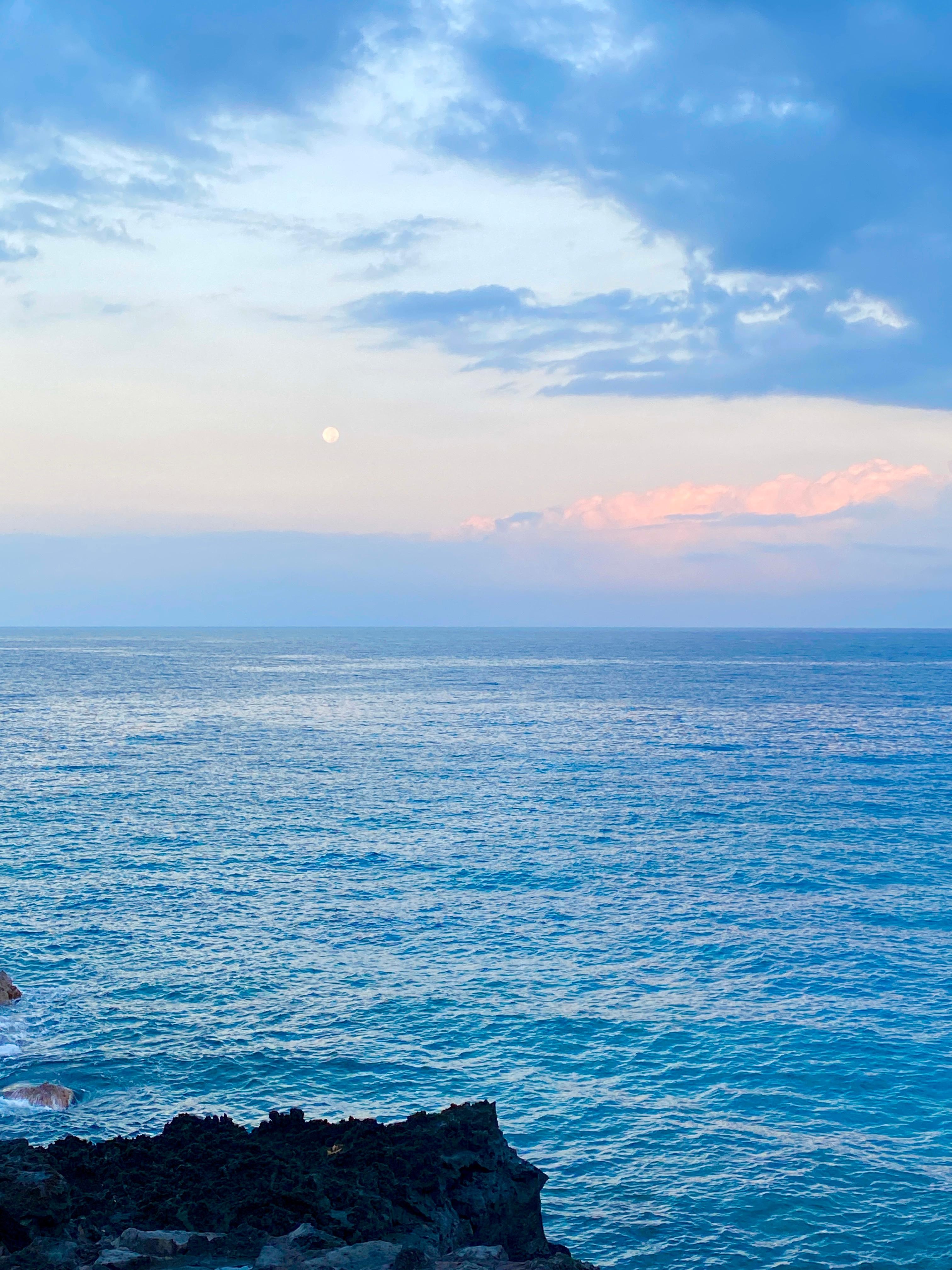 The moon setting just after sunrise, taken from the balcony.
