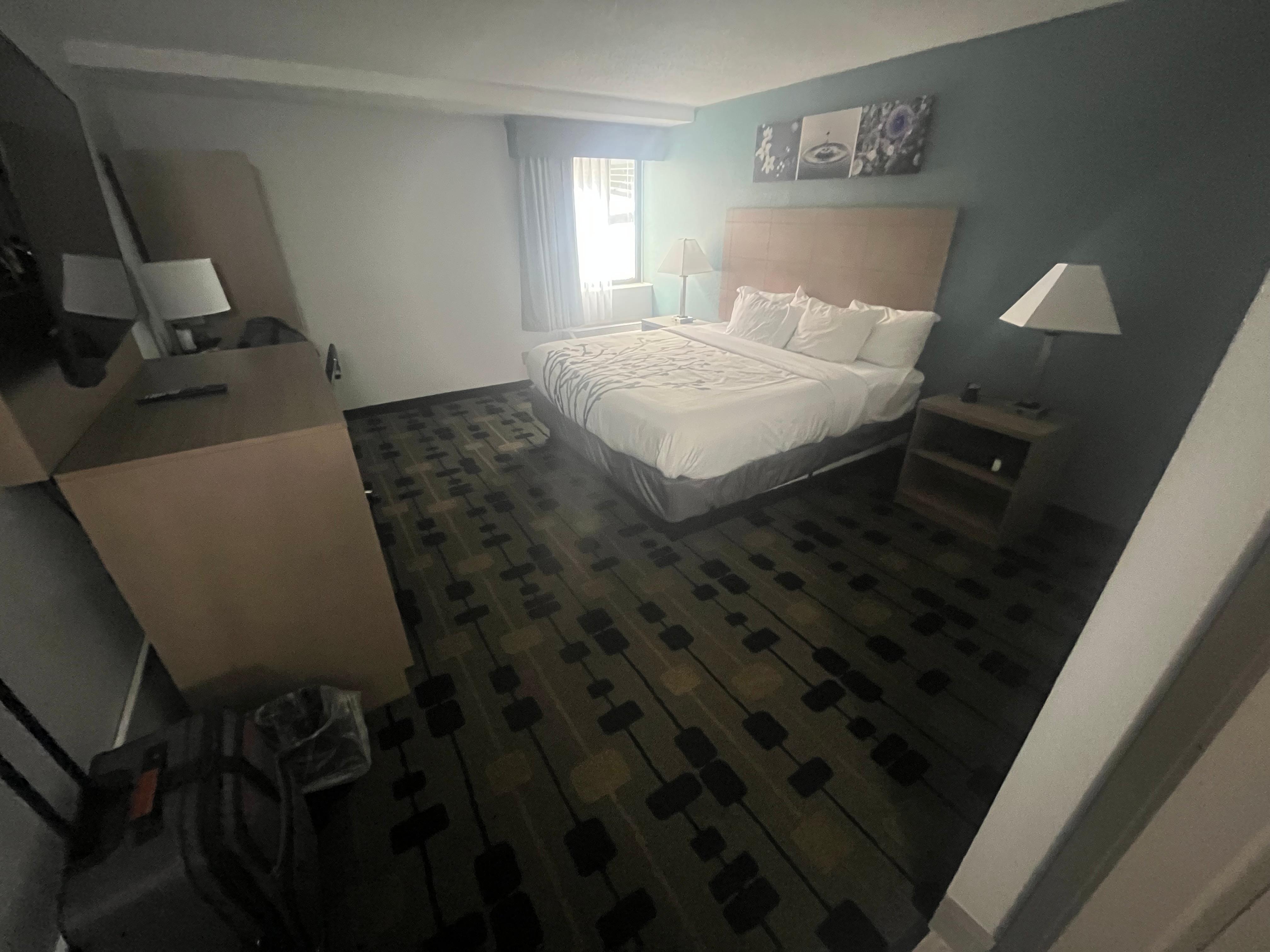 Large room with a mini fridge, coffee maker, and microwave.