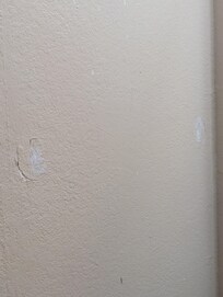 Cracks and dings in all the walls.