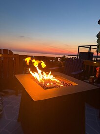 Sunset from the side deck with propane fire pit.