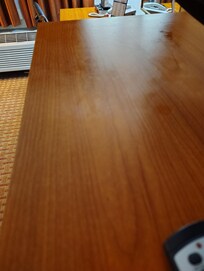 Sticky and greasy substances on the table, tv stand, and nightstands