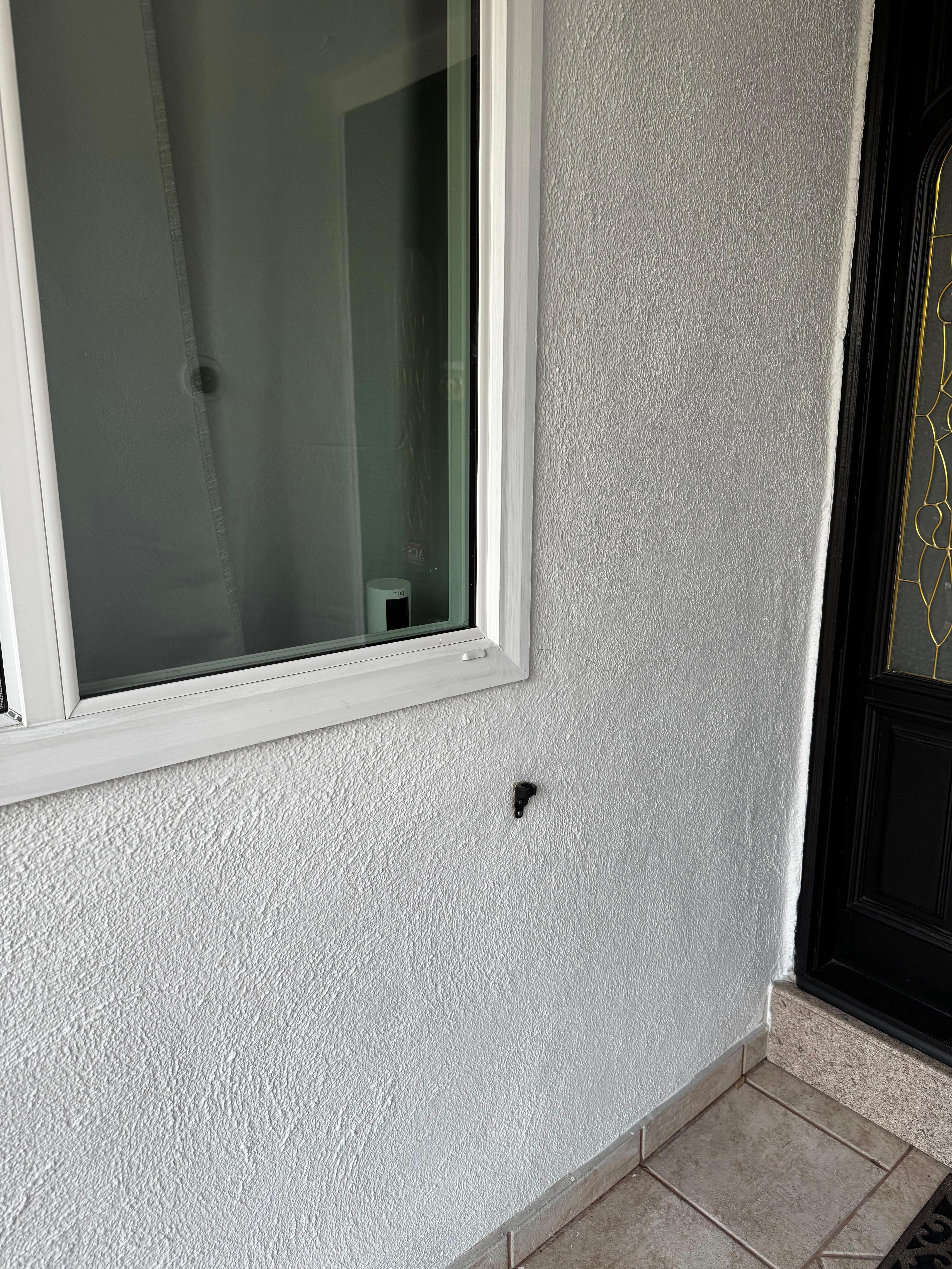 Camera in a bedroom facing the front door