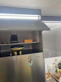 Water dripping down fridge