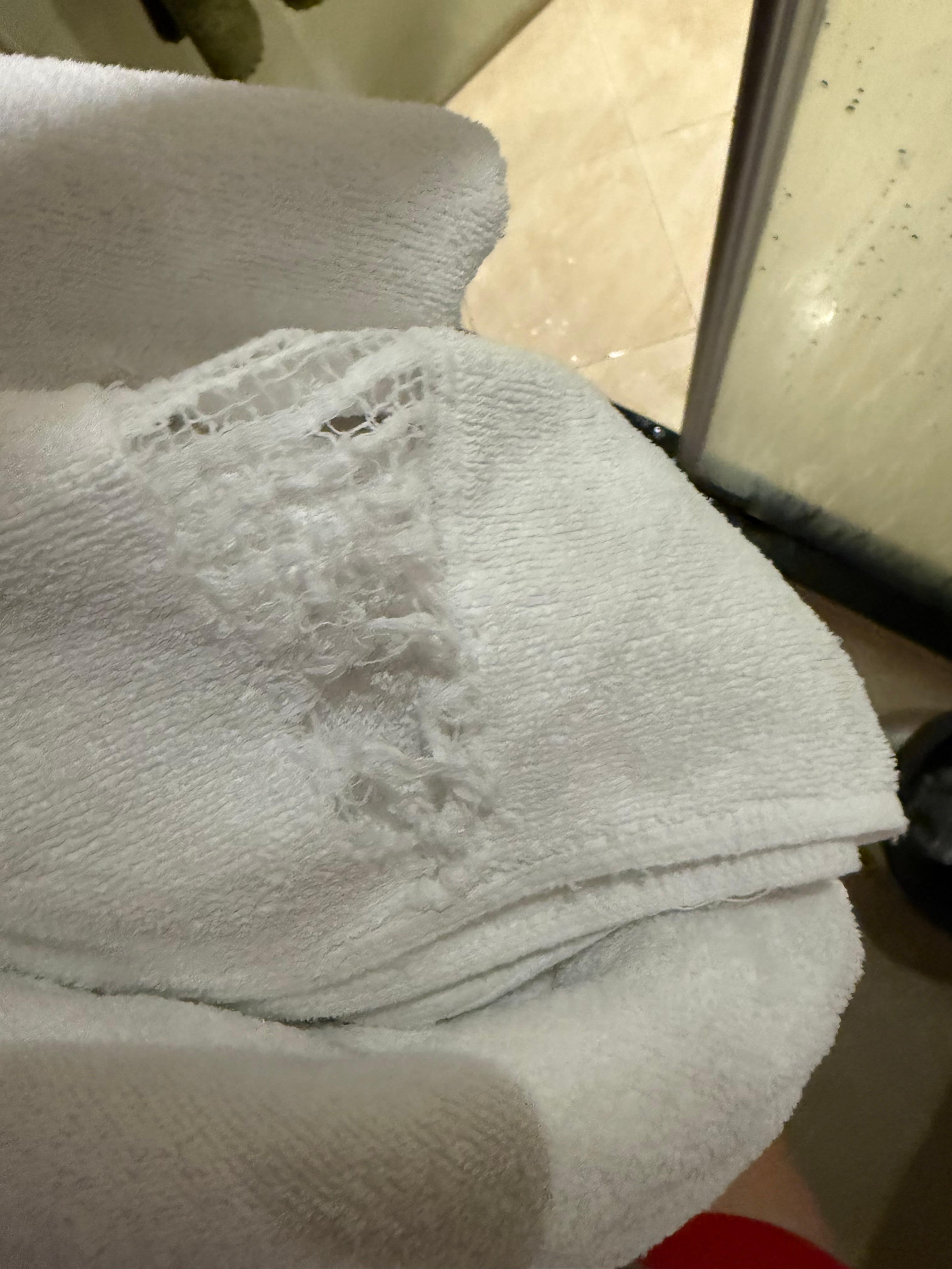 All towels were ripped and smelled odd. Was not able to use any of them. 