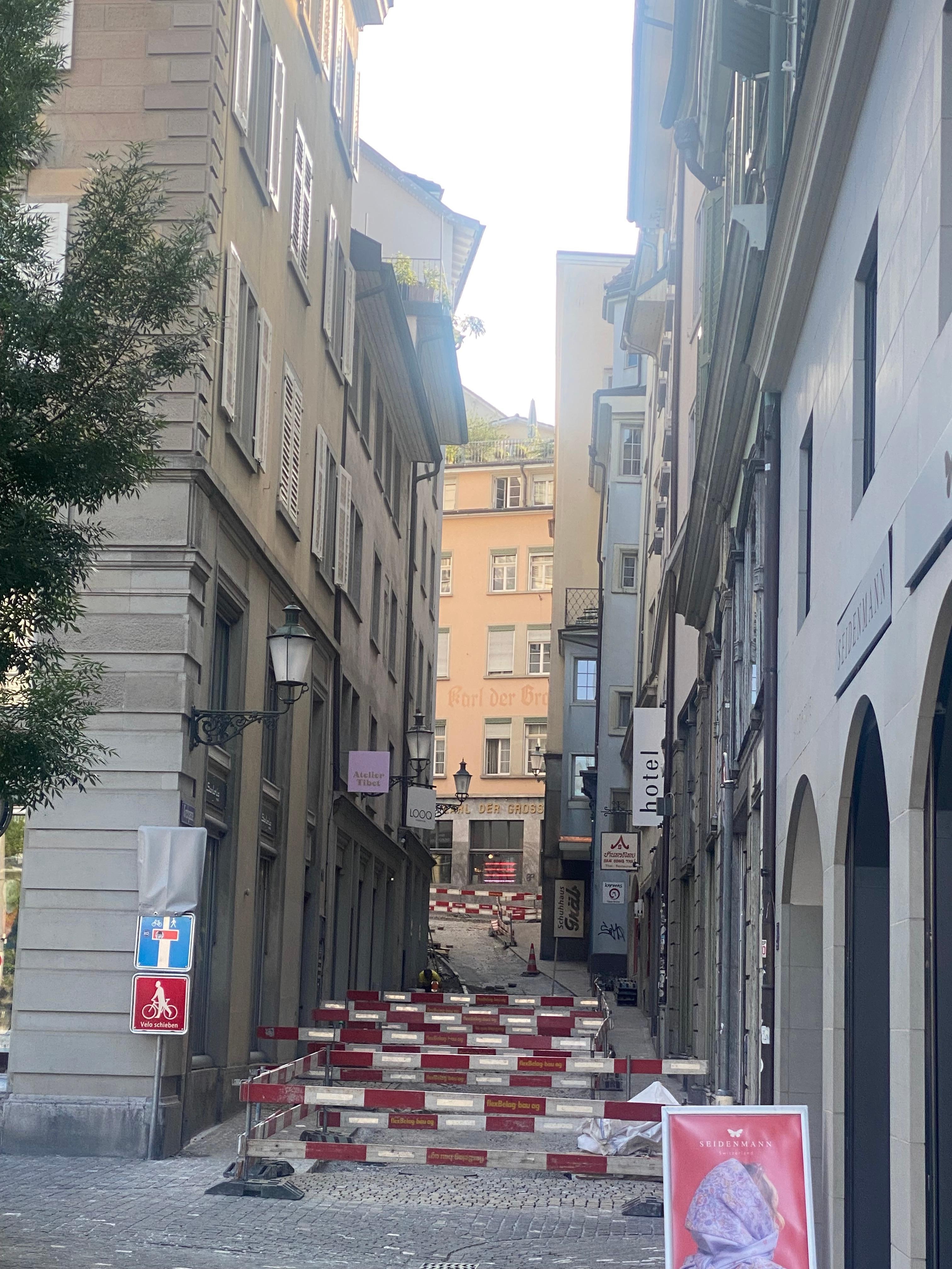 Little street in front of Hotel. Cobblestone repair