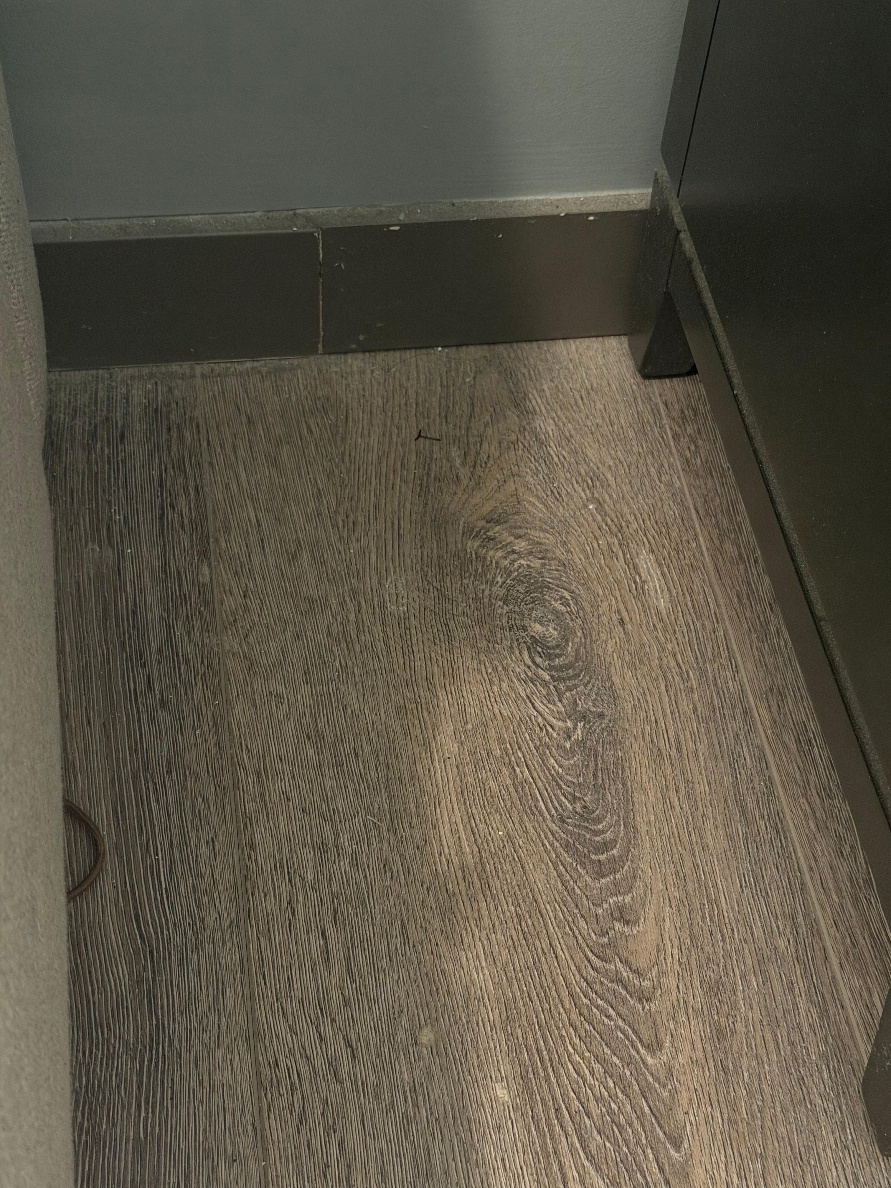 Contact and hair tie next to bed 