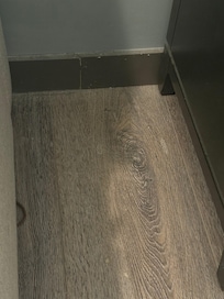 Contact and hair tie next to bed