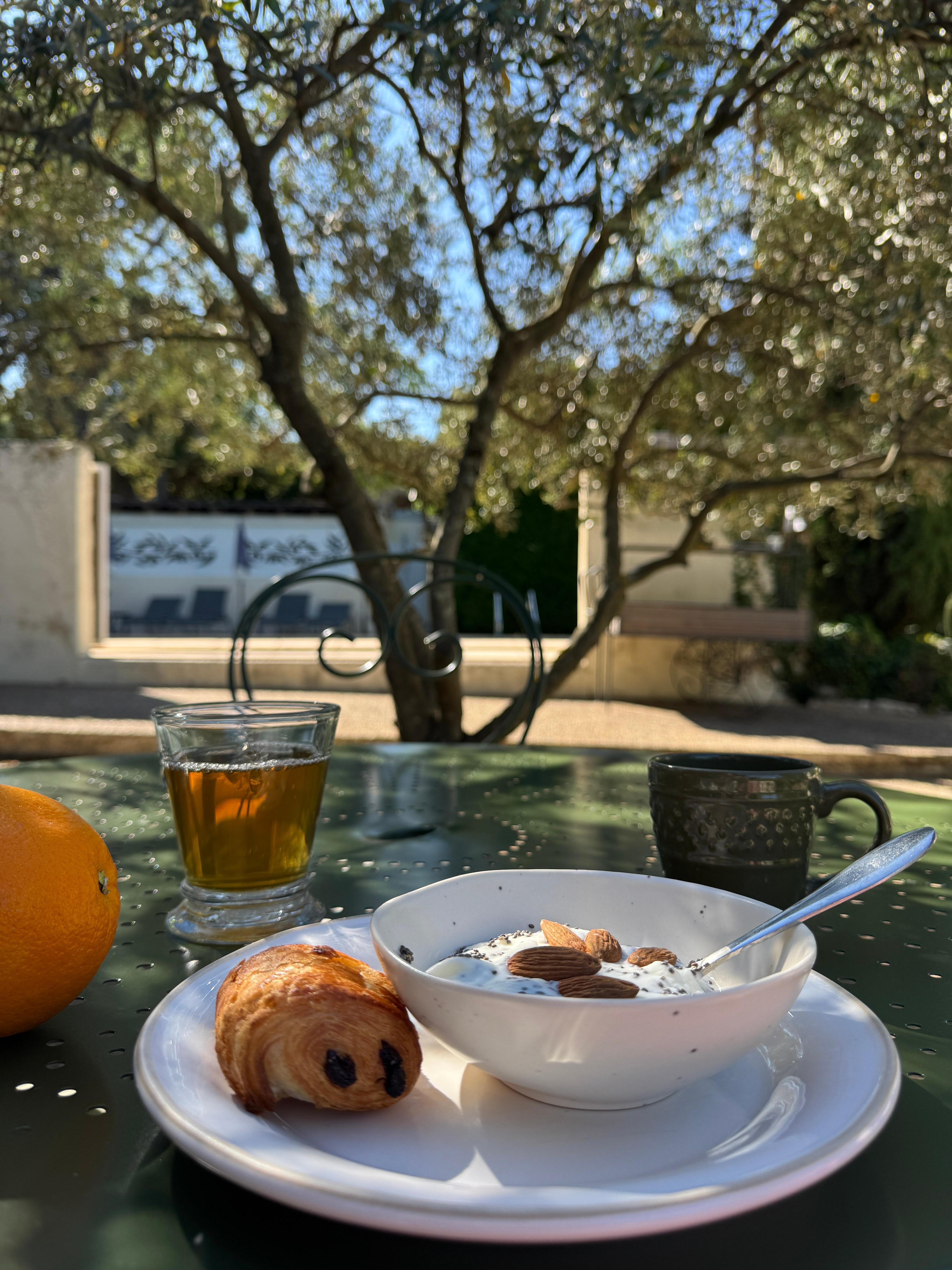 Breakfast under olive tree on terrace 