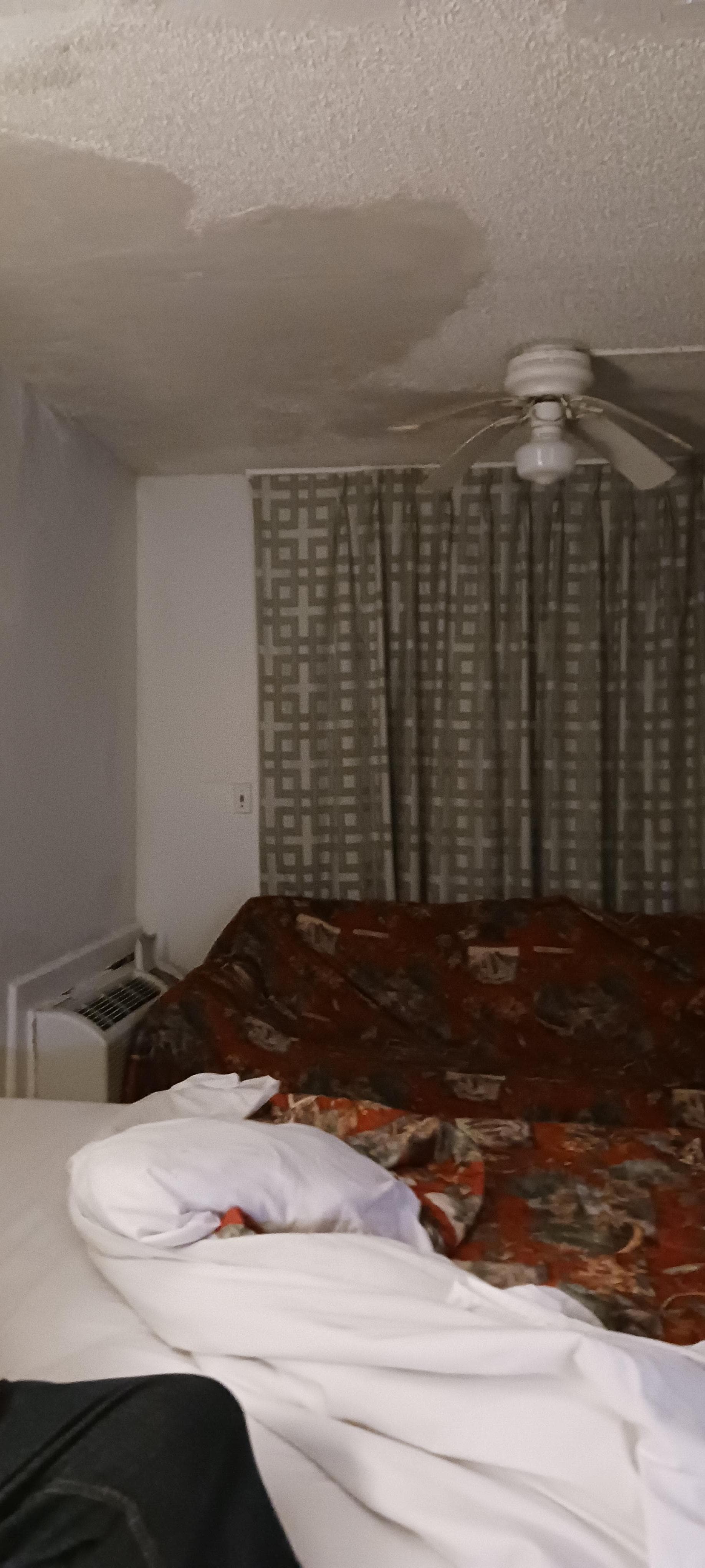 Dirty blanket thrown over the couch