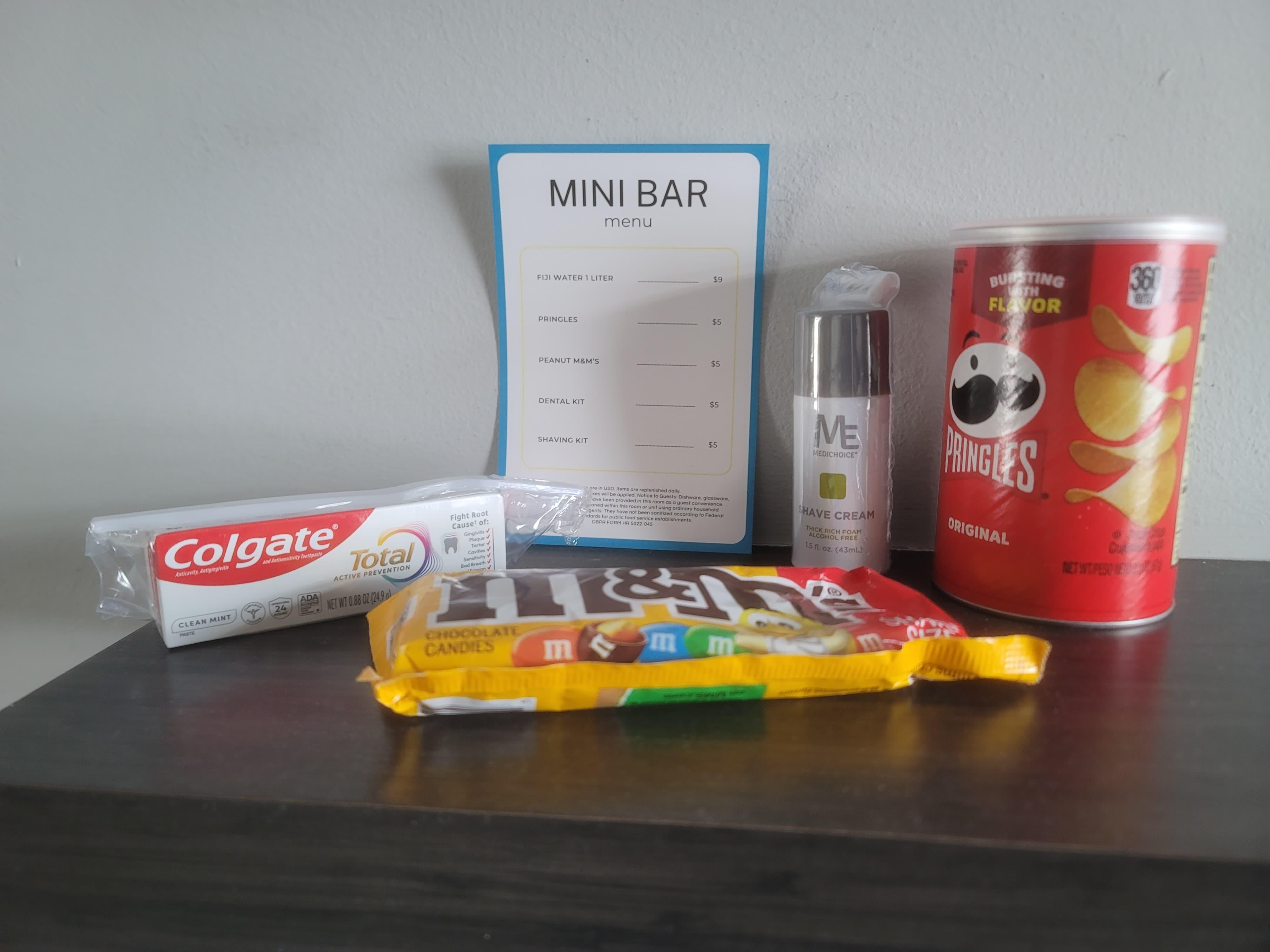 Overpriced mini-bar with items yu could buy right across the street at regular price. Notice the fee for the Fiji water but threre's no Fiji water.