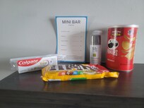 Overpriced mini-bar with items yu could buy right across the street at regular price. Notice the fee for the Fiji water but threre's no Fiji water.